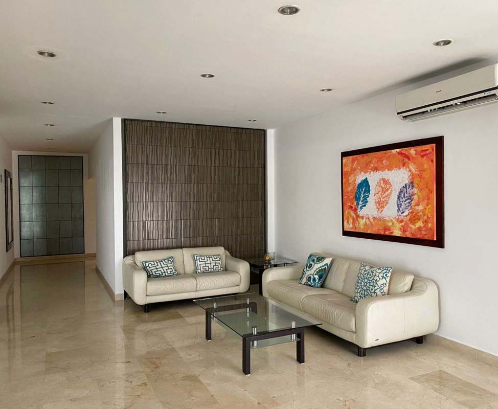 Spacious living room in PH Marina View with large window and panoramic city views in San Francisco Panama City
