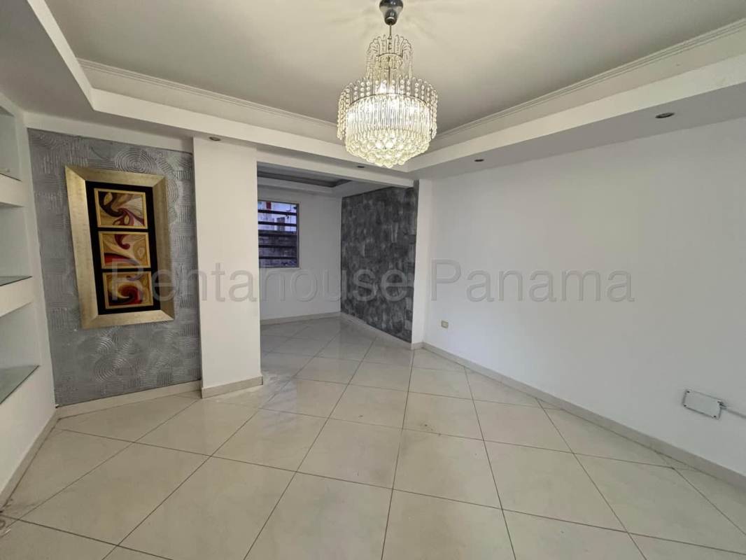 Spacious living room with tiled floor, recessed ceiling, chandeliers in Altos de Santa María rental home
