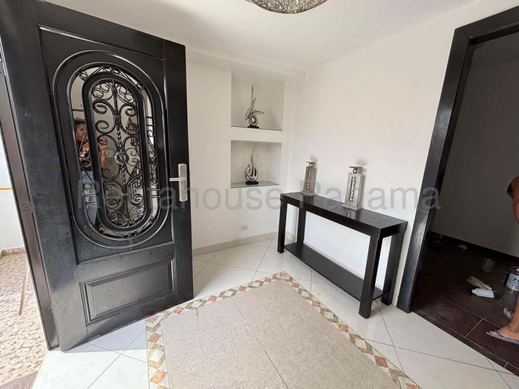 Swimming pool with covered BBQ pavilion and stone accent walls in Altos de Santa María Panama rental house