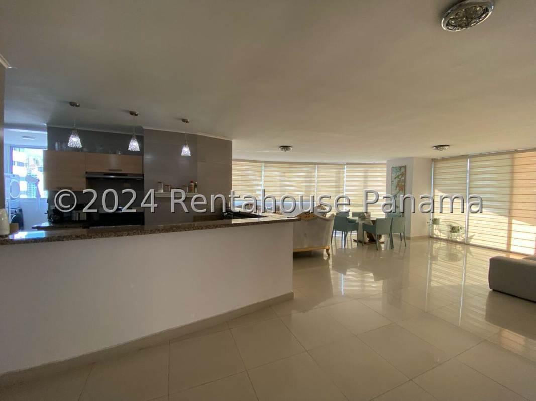 Spacious open kitchen with granite countertops and breakfast bar in PH San Francisco Park Panama City