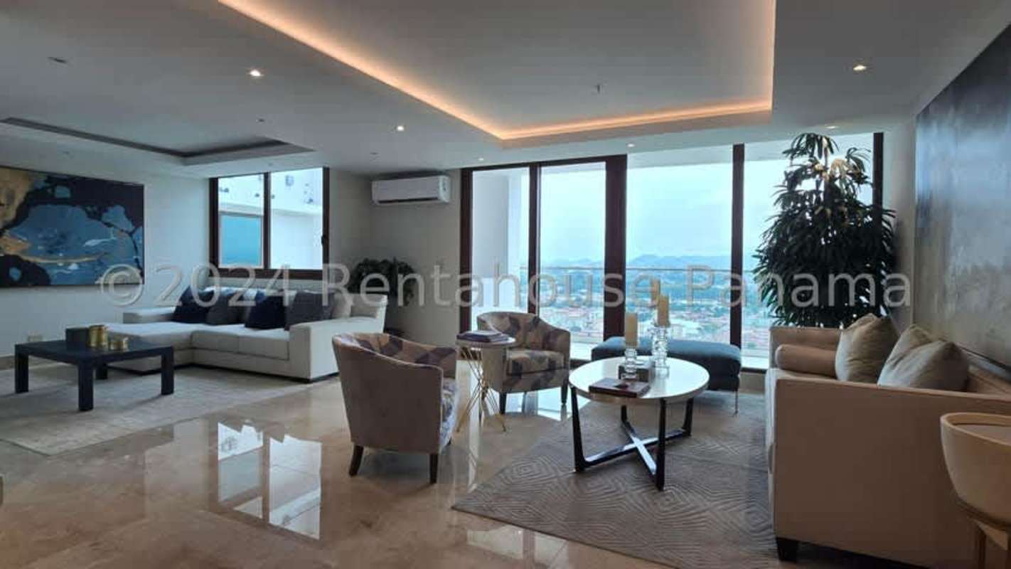 Open dining area and family den with large windows luxury PH The Colonial Santa Maria Panama