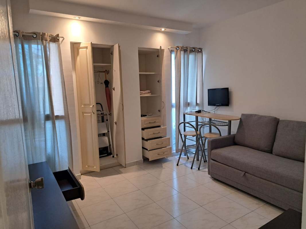 Studio area with tiled flooring, dining set, closet, large windows in PH Clayton Tower