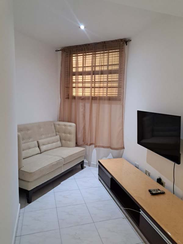 Bedroom with tile flooring, large window with curtains, built-in closet in Clayton Tower Panama