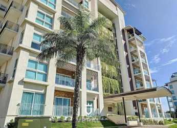 Fully equipped kitchen with granite counters, appliances and wood cabinetry in Playa Escondida apartment