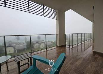 Spacious open-plan living room with floor-to-ceiling windows and sea views in Playa Escondida Panama apartment