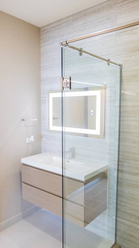 Modern residents lounge with floor-to-ceiling windows city ocean views