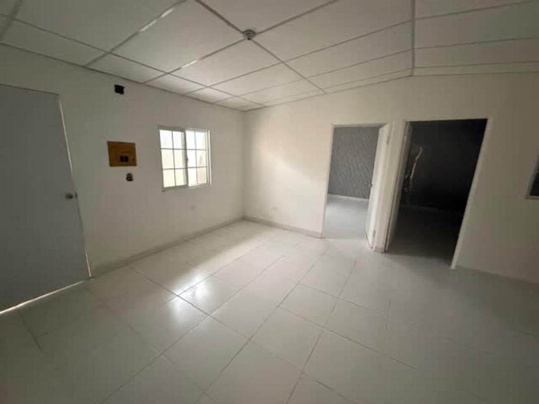 Single-story house with red tile roof, gated driveway, arched windows Los Portales Pacora Panama