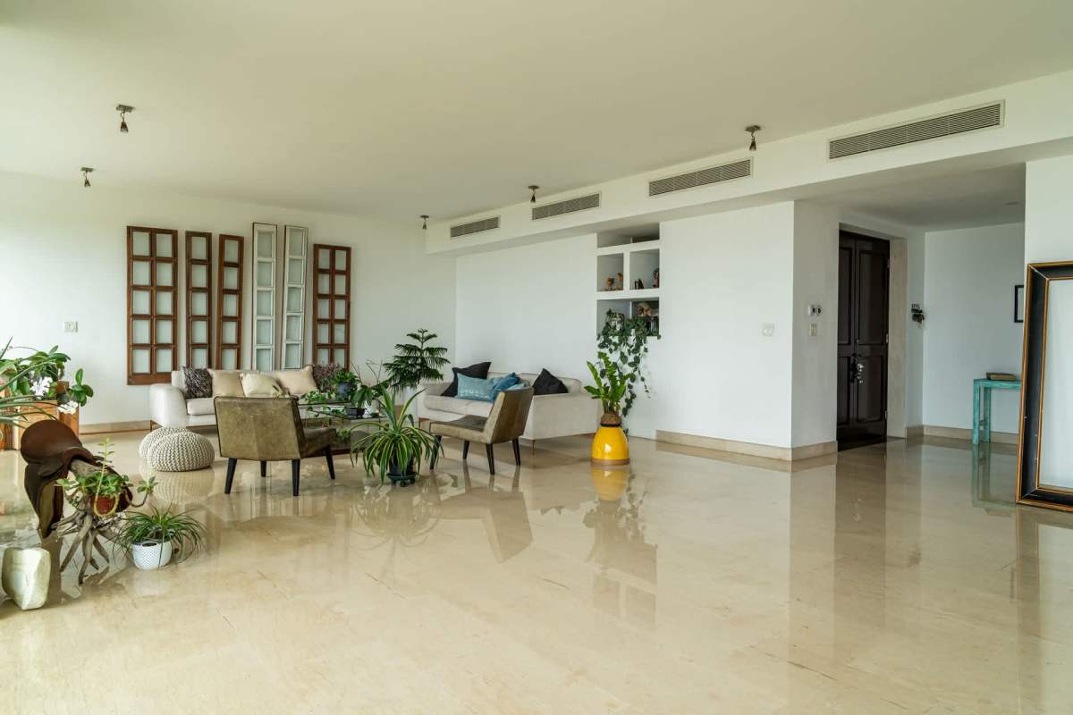 Remodeled gourmet kitchen with white cabinetry quartz counters stainless steel appliances Costa del Este Panama