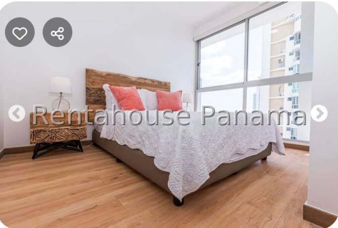 Master bedroom with large windows city view and closet in PH Quartier Marbella Panama City