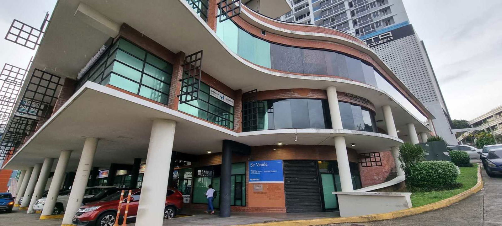 Open commercial office space at San Fernando Plaza with panoramic corner windows and tiled floors