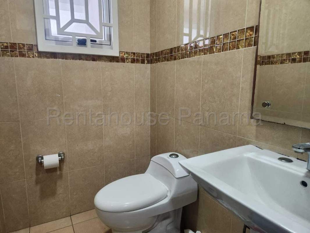 Bathroom with beige tiles, sink, mirror, window and modern style Dorado Village Condado del Rey