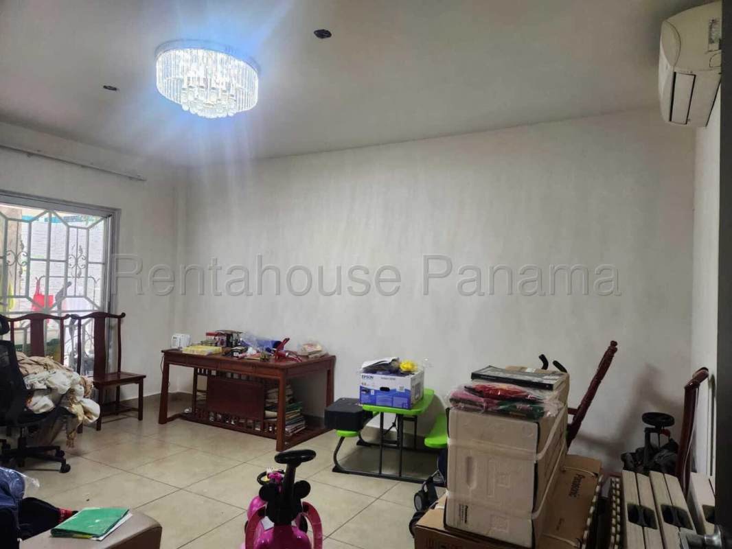 Living room with chandelier, window security bars and ample space Dorado Village Panama