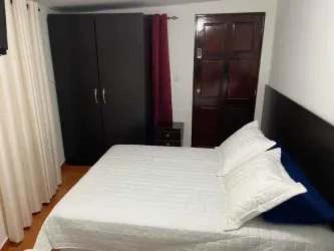 Spacious double bedroom with AC, ceiling fan, tile floors Tocumen pool home for sale