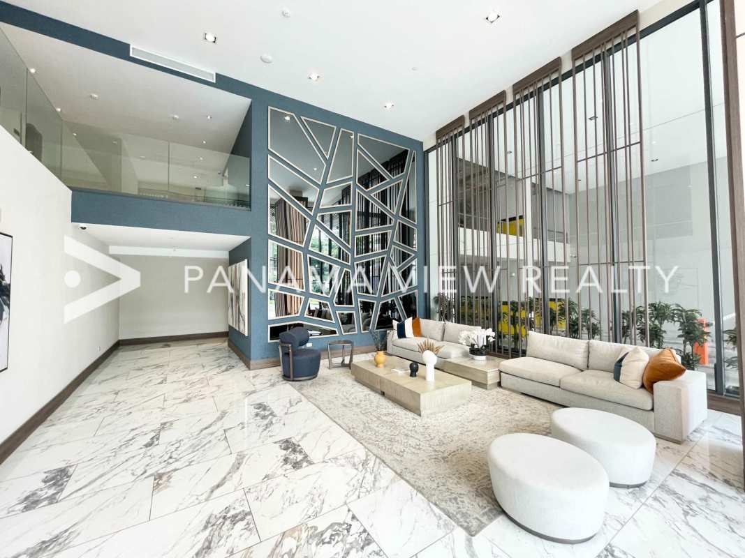 Spacious penthouse bedroom with closet and large windows offering city views in PH Prestige Panama City