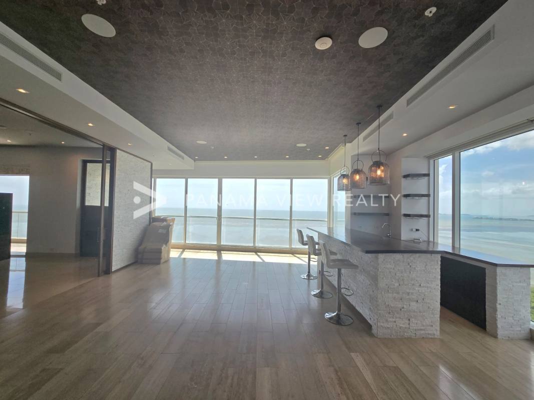 Dedicated home cinema room with projector and surround sound in luxury PH Marea II tower