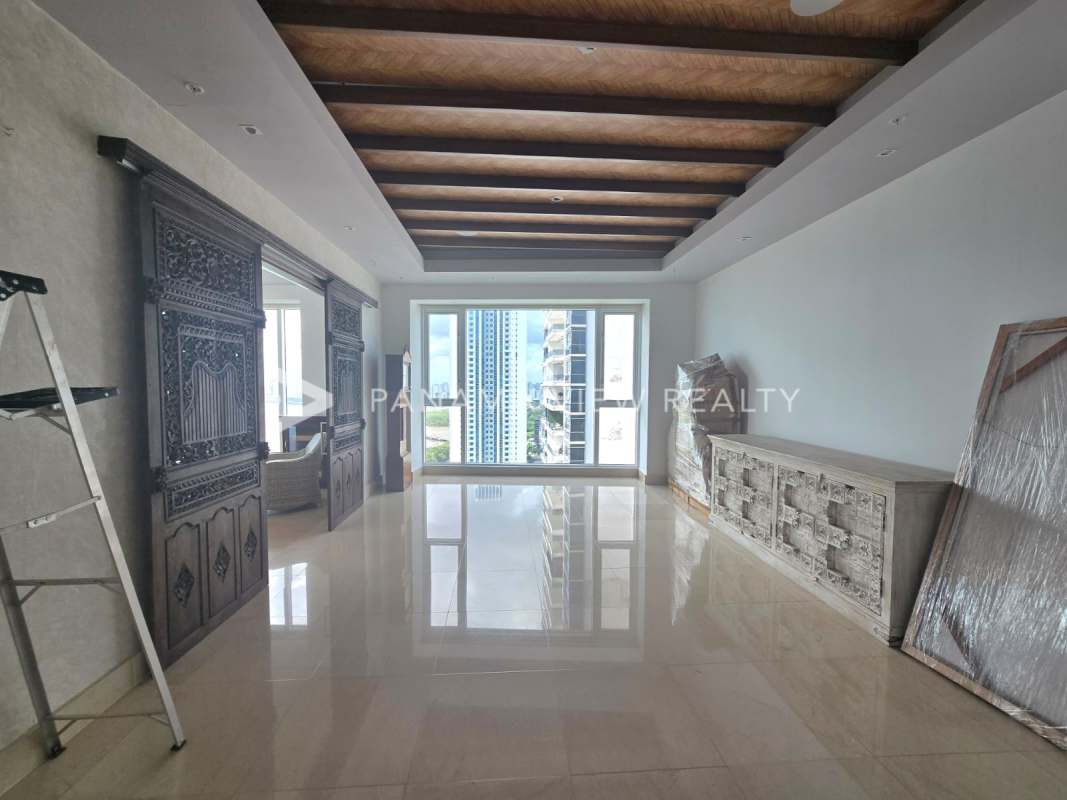 Elegant master bedroom with panoramic windows overlooking ocean in PH Marea II Costa del Este