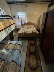 Compact bathroom with ceramic tile shower and sink in teak farm country property Panama