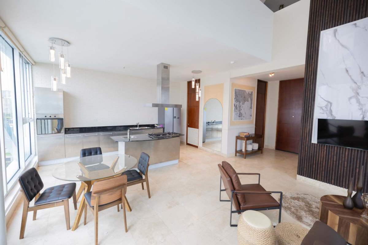 Spacious loft with double height glass windows overlooking Pacific Ocean at PH Ocean Club