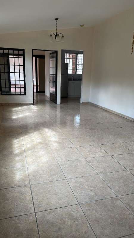 Renovated kitchen in Panama house with granite counters, gas stove and natural light Brisas del Golf