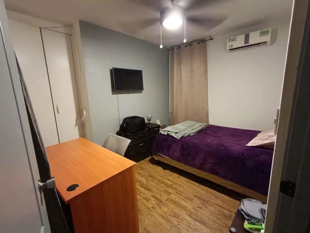 Bedroom with closet and natural light in PH Hato Tower Hato Pintado Panama apartment