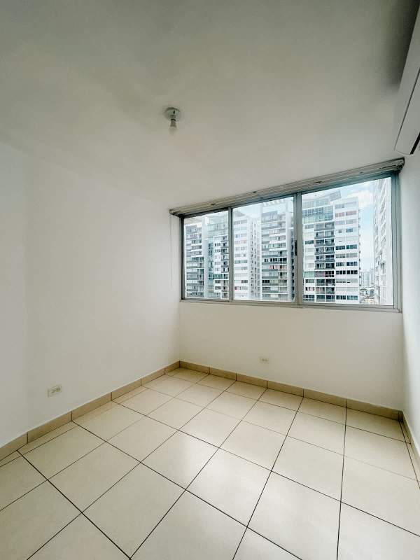 Bright bedroom with large window and tile floor PH Central Park apartment for rent Panama