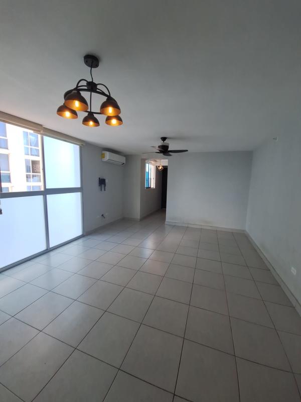 Modern living room with large windows, tiled floors, AC unit in PH Carrasquilla Park View near Parque Omar