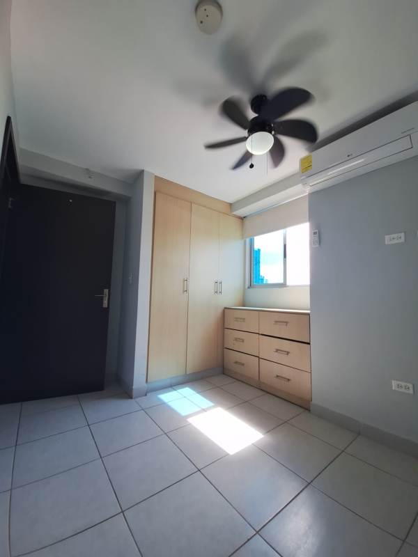 View of laundry and kitchen areas with appliances and granite countertop at PH Carrasquilla Park View near Parque Omar