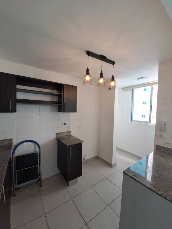 Kitchen with granite countertops, cabinetry and tile flooring in PH Carrasquilla near Parque Omar Panama City