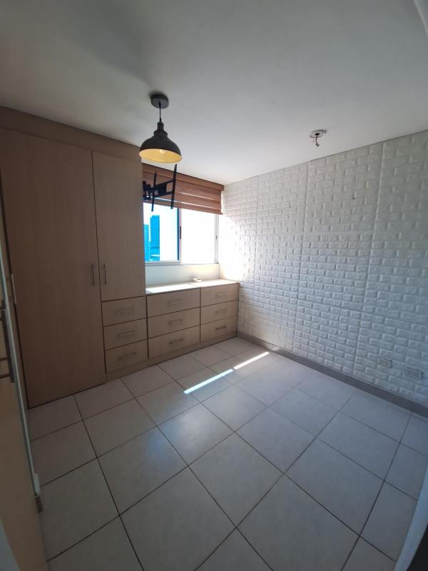 Bedroom with ceramic tile floor, built-in wardrobe, AC and window view in PH Carrasquilla Park View Panama City