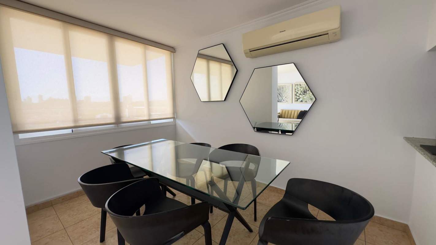 Modern kitchen with granite countertops, stainless appliances and laundry in Elevation Tower Panama