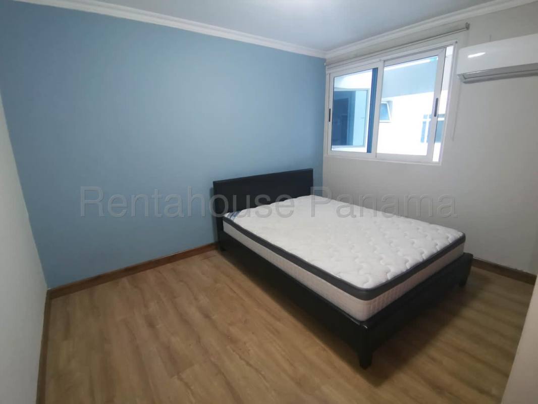 Bathroom with glass shower enclosure, mirror and sink in PH Bella Vista Park Panama City