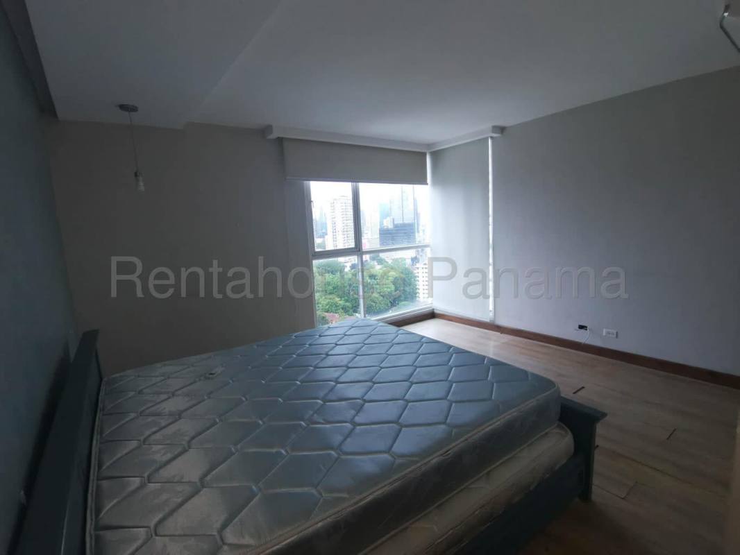 Outdoor swimming pool area in PH Bella Vista Park overlooking Panama City skyline