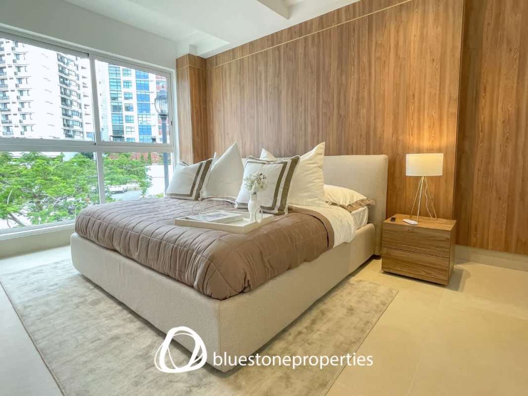 Master bedroom with large windows and ocean view at PH Oceana Santa María Panama City