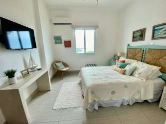 Large master bedroom ocean view balcony Punta Barco luxury condo