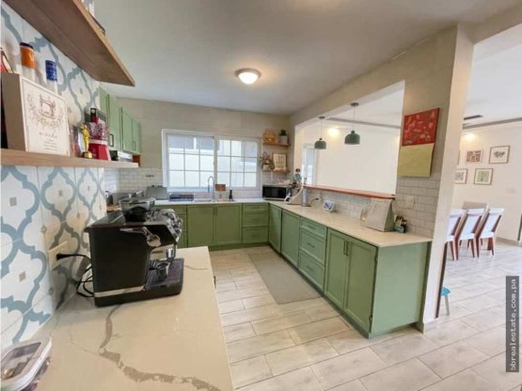 Large swimming pool with lounge deck in Villa Valencia community Costa Sur Panama