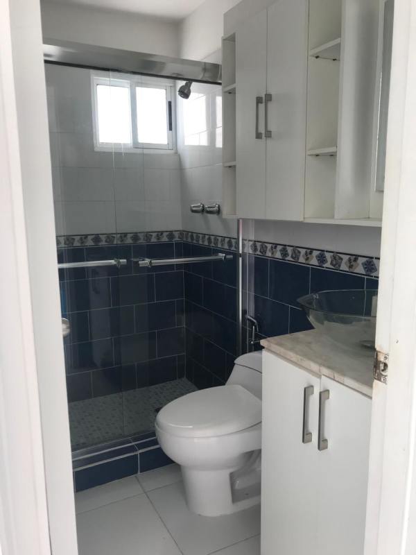 Large window with city view roller blinds inside apartment PH Rio Abajo Panama