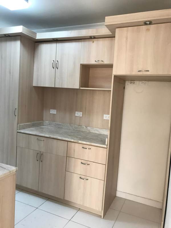 Contemporary bathroom featuring navy and white tiles, glass vessel sink, glass shower at PH Rio Abajo Residences Panama City