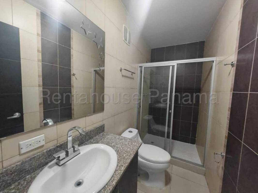 Bedroom with built-in wardrobe, ceramic tile floors in PH Serenity Panama