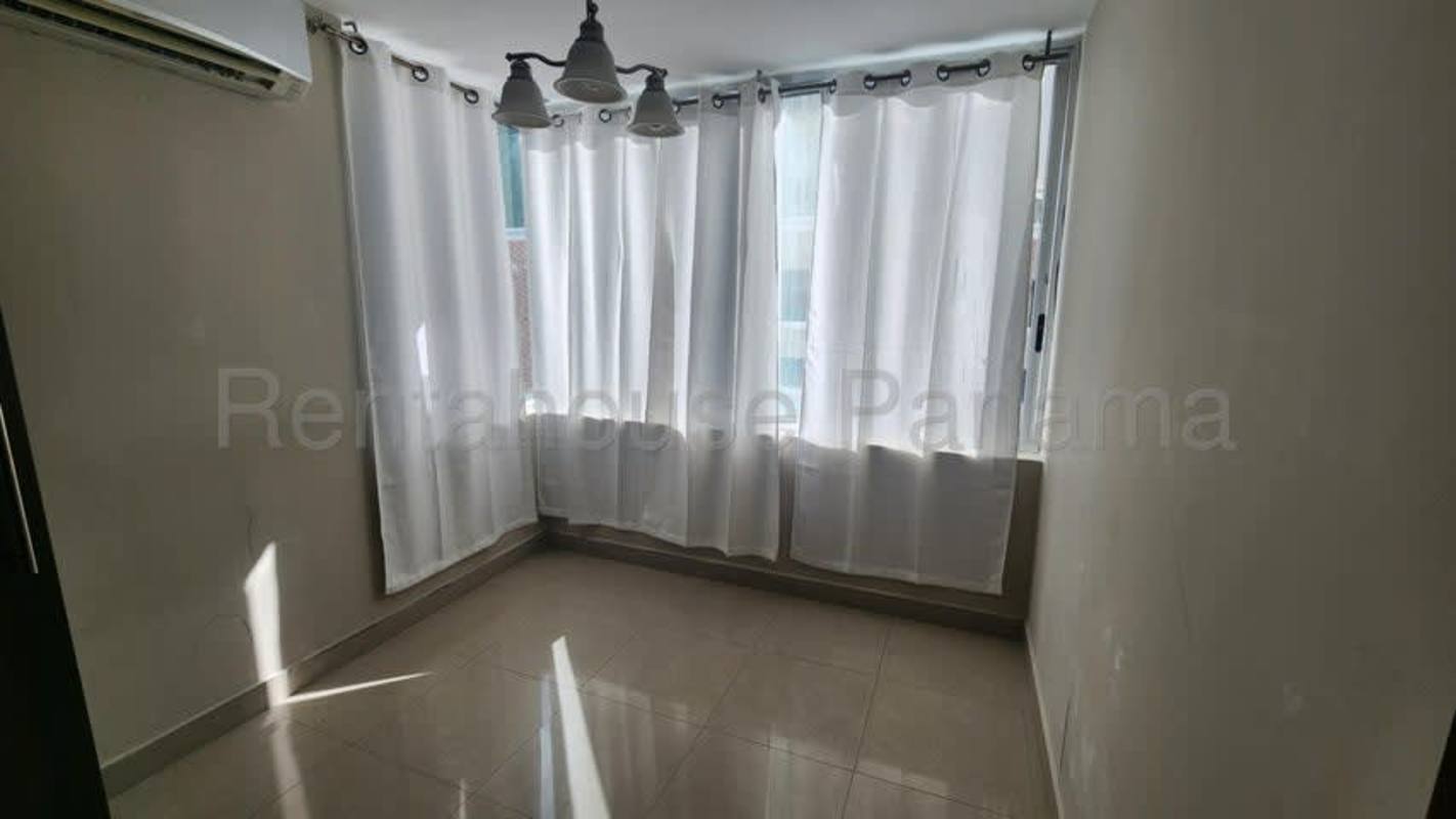 Bedroom with large window, tile floor and closet space PH Costa del Este apartment Panama