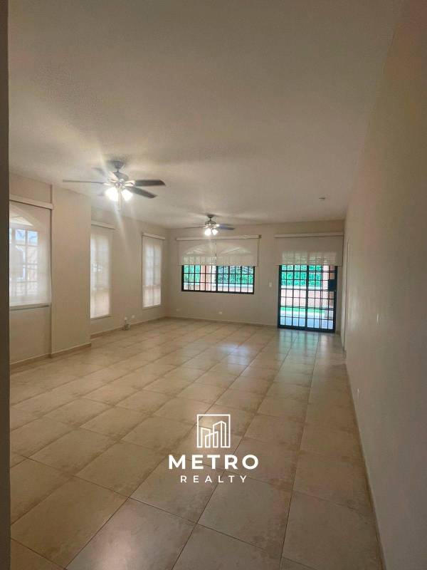 Kitchen with granite countertops, wood cabinets large window Clayton Village Panama City