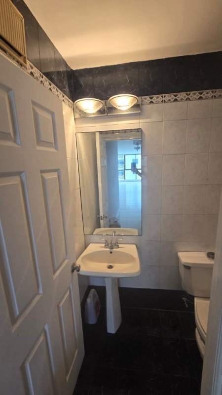 Enclosed curved sunroom with floor to ceiling panoramic city view windows in PH Terrazas del Cangrejo Panama