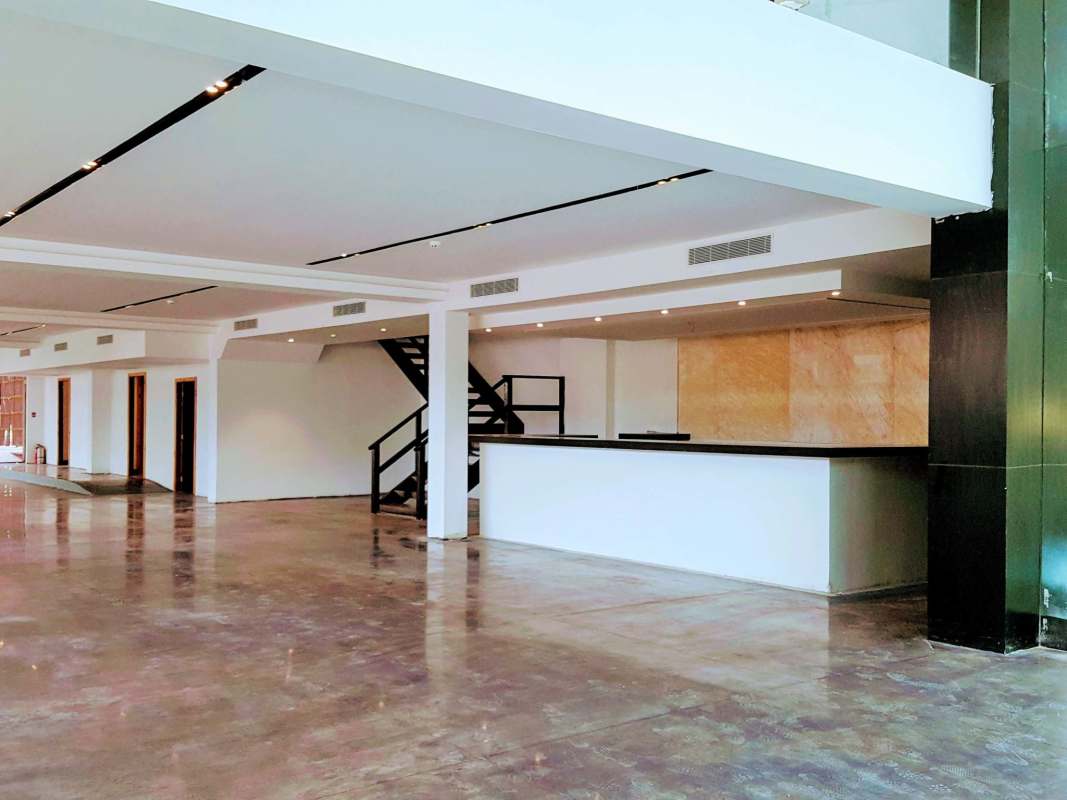 Reception area with staircase and glass elements in commercial building Bella Vista
