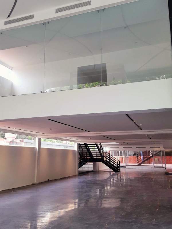 Polished concrete open floor with large windows in Bella Vista for rent