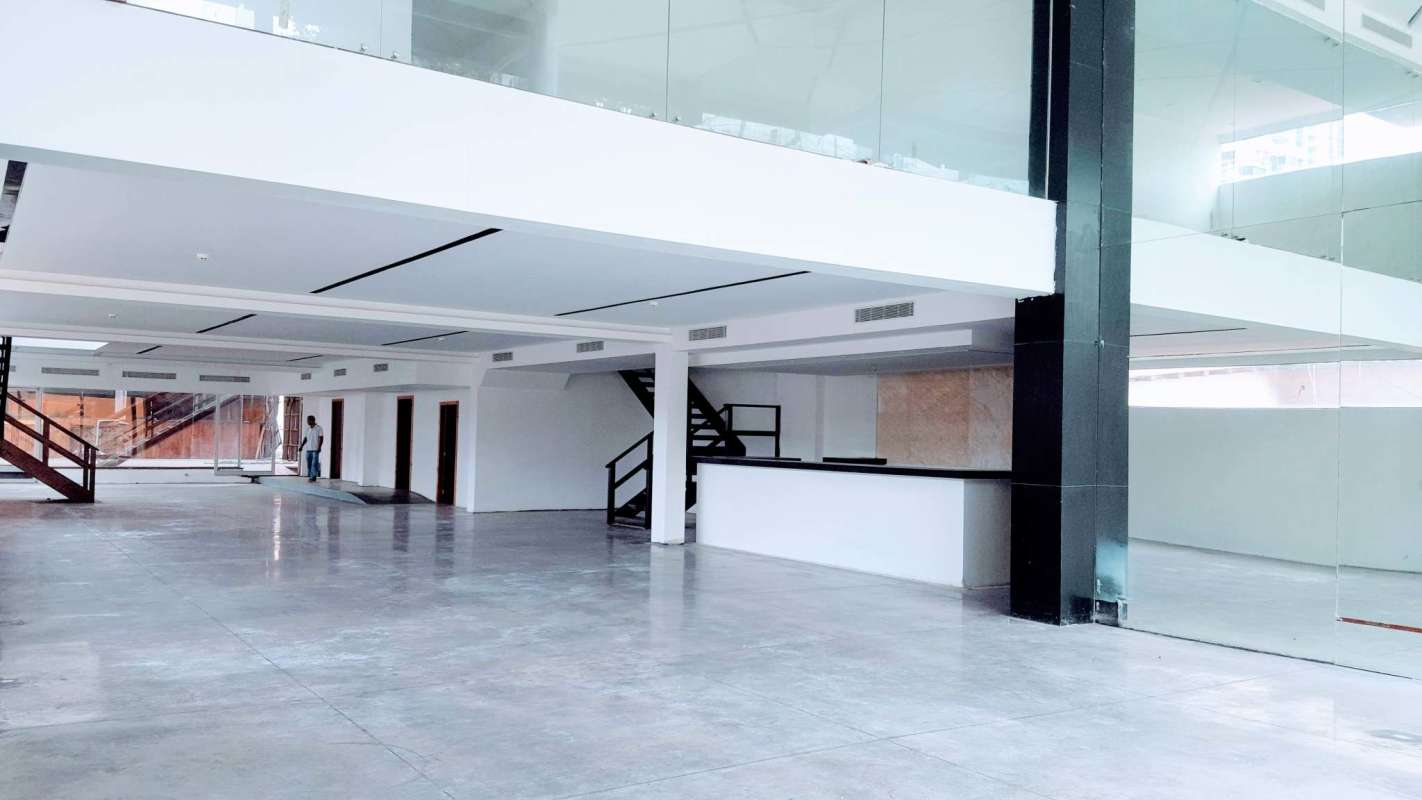 Spacious mezzanine level with glass railing inside commercial property Bella Vista