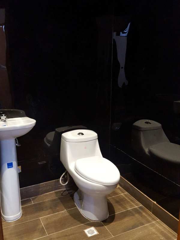 Open plan commercial interior with mezzanine and black staircases Bella Vista Panama