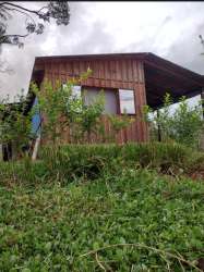 Rustic house with sloped roof surrounded by hillside vegetation Veraguas Panama