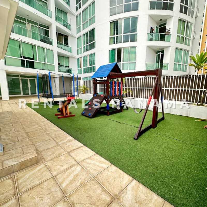 Rooftop swimming pool and lounge chairs with Panama City view at PH The Cosmopolitan