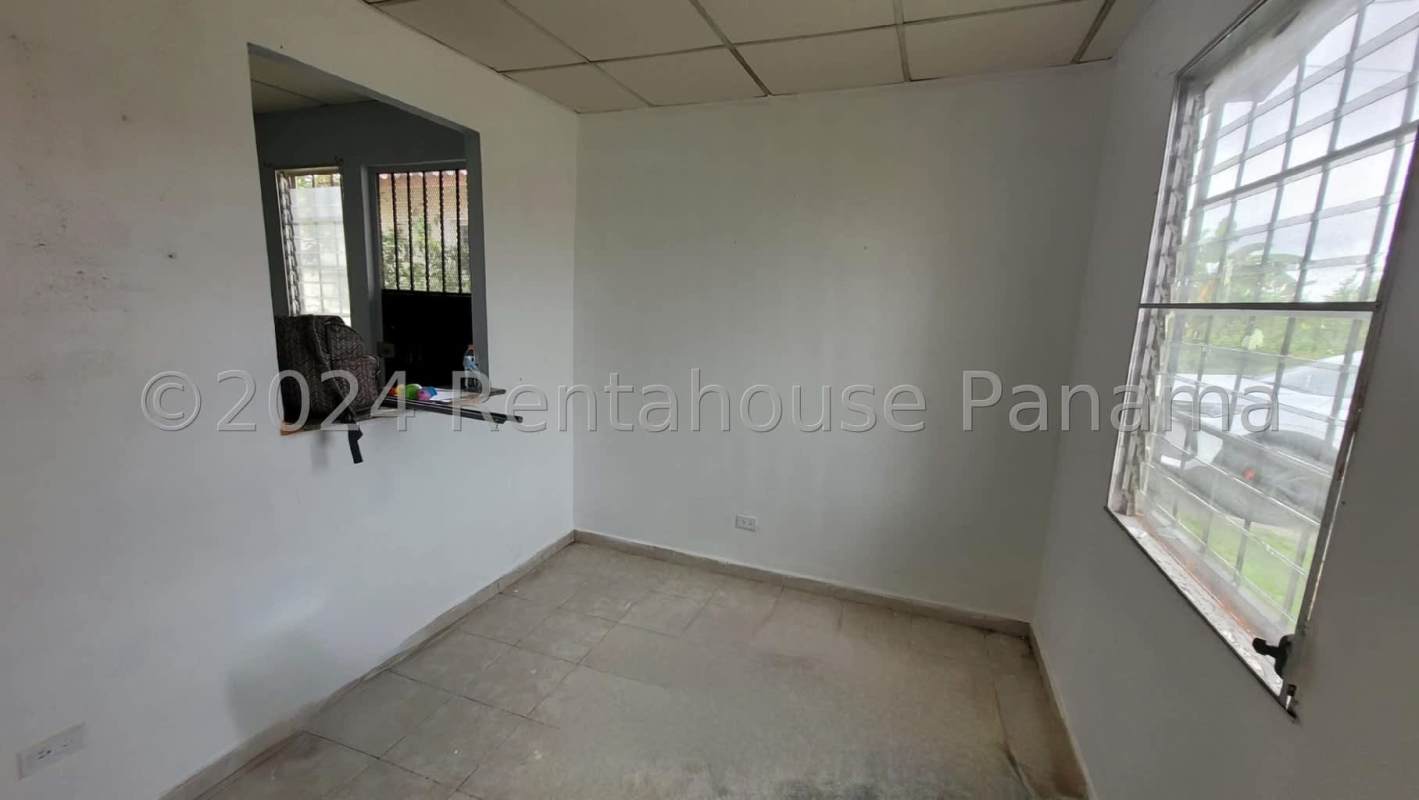 Bright living room with ceramic tiles and accent wall in house Pacora Panama