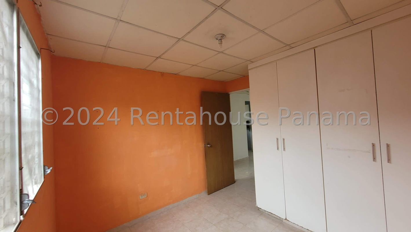 Compact bathroom beige tiles toilet sink mirror cabinet Pacora Panama