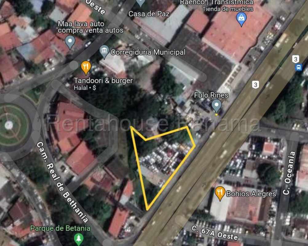 View from Transistmica avenue with fence line around large commercial lot ready for development Panama